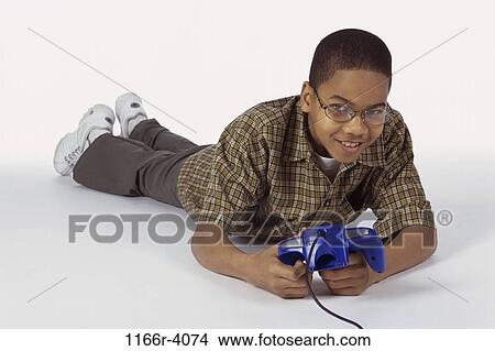 Picture - people, playing, eyeglasses, boy, child, play, game. Fotosearch