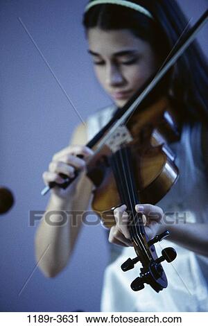 Stock Image - people, playing, girl, violin, child, play, indoors. Fotosearch