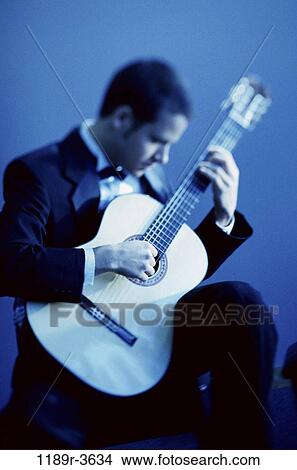 Picture - people, playing, guitar, arts, entertainment, play. Fotosearch
