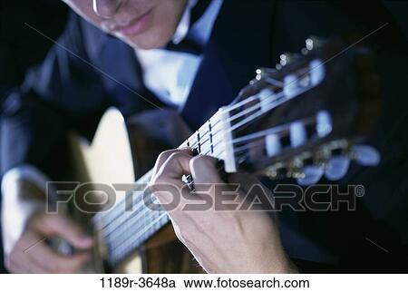 Stock Image - people, playing, guitar, arts, entertainment, play. Fotosearch