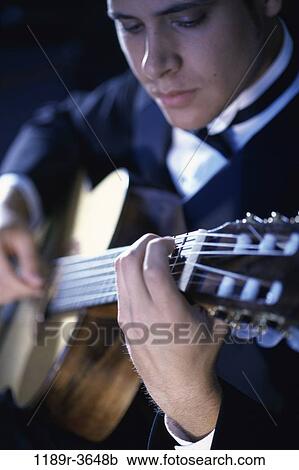 Stock Image - people, playing, guitar, arts, entertainment, play. Fotosearch