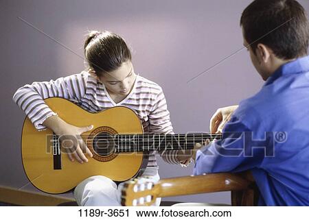 Stock Image - people, playing, teacher, music, play, student, teaching. Fotosearch