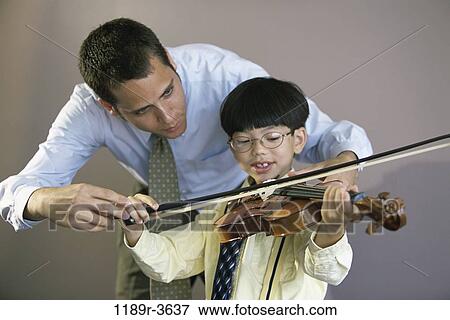 people, playing, teacher, music, violin, play, student View Large Photo Image Stock Photo - people, playing, teacher, music, violin, play, student. Fotosearch