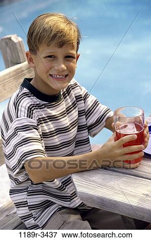 Stock Photo - people, pool, drinking, boy, outdoors, poolside, child. Fotosearch