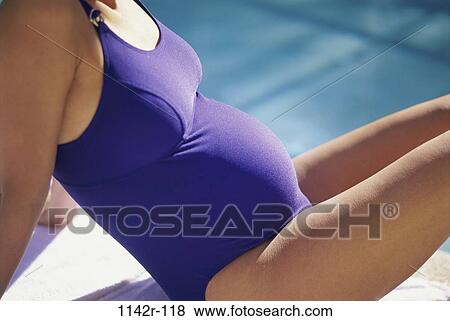 people, pool, woman, outdoors, pregnancy, Caucasian, swimwear View Large Photo Image Stock Photo - people, pool, woman, outdoors, pregnancy, Caucasian, swimwear. Fotosearch