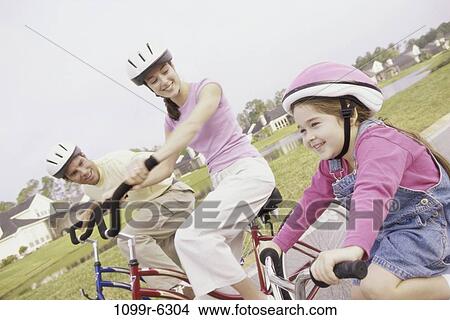 people, riding, outdoors, bicycles, family, daughter View Large Photo Image Picture - people, riding, outdoors, bicycles, family, daughter. Fotosearch