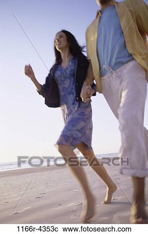 people, running, walking, couple, beach, brunette, clothed View Large Photo Image Stock Image - people, running, walking, couple, beach, brunette, clothed. Fotosearch