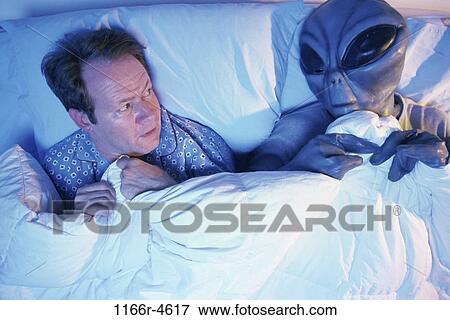 Stock Photo - people, sleeping, bed, alien, Middle-aged, frightened. Fotosearch