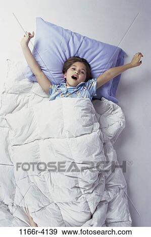 people, sleeping, bed, stretching, girl, child, tired View Large Photo Image Stock Photo - people, sleeping, bed, stretching, girl, child, tired. Fotosearch