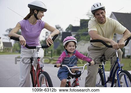 people, smiling, outdoors, bicycles, smile, family View Large Photo Image Stock Image - people, smiling, outdoors, bicycles, smile, family. Fotosearch