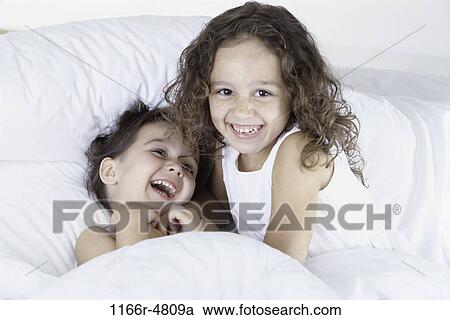people, smiling, playing, bed, laughing, smile View Large Photo Image Stock Image - people, smiling, playing, bed, laughing, smile. Fotosearch