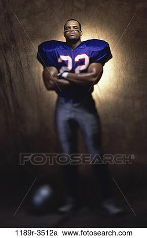 people, spotlight, football, arms, crossed, serious View Large Photo Image Stock Image - people, spotlight, football, arms, crossed, serious. Fotosearch