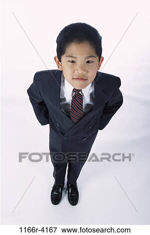 Stock Photo - people, suit, Asian, boy, business, serious, humor. Fotosearch