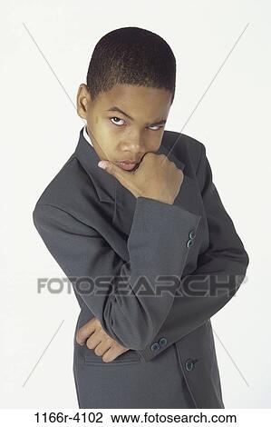 Stock Image - people, suit, boy, business, confrontation, serious, humor. Fotosearch