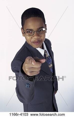 people, suit, eyeglasses, boy, pointing, business, point View Large Photo Image Stock Image - people, suit, eyeglasses, boy, pointing, business, point. Fotosearch
