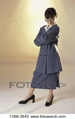 Stock Image - people, suit, eyeglasses, girl, costume, business, humor. Fotosearch