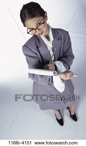 Stock Image - people, suit, eyeglasses, Hispanic, girl, clipboard, business. Fotosearch