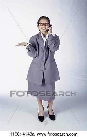 people, suit, talking, eyeglasses, phone, girl, costume View Large Photo Image Stock Image - people, suit, talking, eyeglasses, phone, girl, costume. Fotosearch
