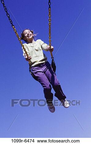 people, swinging, girl, swing, playground, outdoors, child View Large Photo Image Picture - people, swinging, girl, swing, playground, outdoors, child. Fotosearch