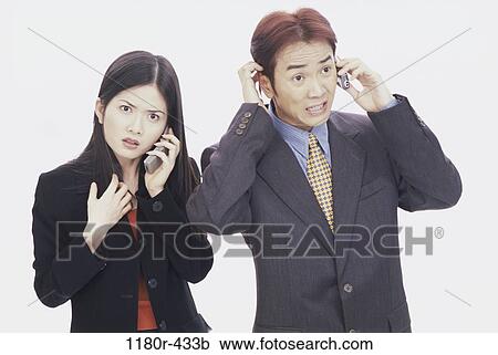 Stock Image - people, talking, Asian, couple, phone, business, frustrated. Fotosearch