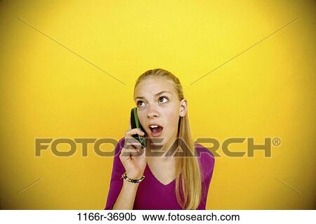 Stock Image - people, telephone, talking, phone, surprise, blond, surprised. Fotosearch