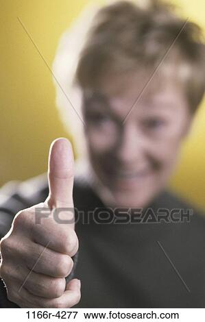 people, thumb, woman, senior, achievement, applause, indoors View Large Photo Image Stock Photo - people, thumb, woman, senior, achievement, applause, indoors. Fotosearch