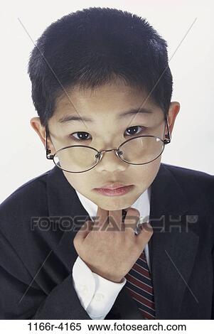 people, tie, suit, Asian, eyeglasses, boy, costume View Large Photo Image Stock Photography - people, tie, suit, Asian, eyeglasses, boy, costume. Fotosearch