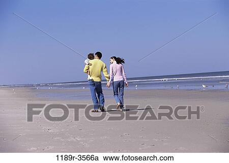 people, walking, beach, carrying, family, backs, parents View Large Photo Image Stock Image - people, walking, beach, carrying, family, backs, parents. Fotosearch