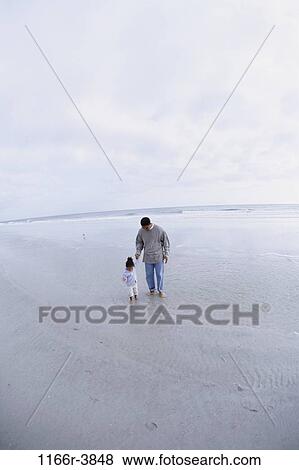 people, walking, beach, distance, family, father, daughter View Large Photo Image Stock Photo - people, walking, beach, distance, family, father, daughter. Fotosearch