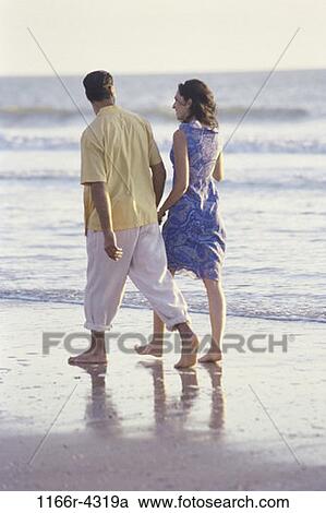 people, walking, couple, beach, romantic, romance, brunette View Large Photo Image Stock Image - people, walking, couple, beach, romantic, romance, brunette. Fotosearch