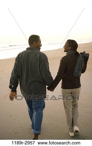 people, walking, couple, beach, backside, clothed, sweaters View Large Photo Image Stock Photo - people, walking, couple, beach, backside, clothed, sweaters. Fotosearch