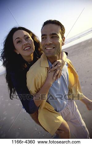 people, walking, couple, Hispanic, outdoors, carrying, piggyback View Large Photo Image Stock Image - people, walking, couple, Hispanic, outdoors, carrying, piggyback. Fotosearch