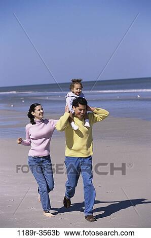 people, walking, Hispanic, beach, carrying, family, daughter View Large Photo Image Stock Image - people, walking, Hispanic, beach, carrying, family, daughter. Fotosearch