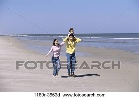 people, walking, Hispanic, beach, carrying, family, daughter View Large Photo Image Stock Image - people, walking, Hispanic, beach, carrying, family, daughter. Fotosearch