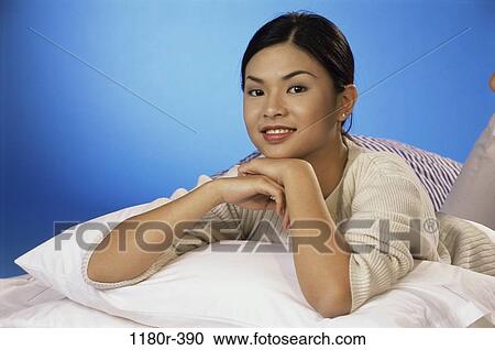 people, woman, Asian, bed, laying, indoors, lay View Large Photo Image Stock Image - people, woman, Asian, bed, laying, indoors, lay. Fotosearch
