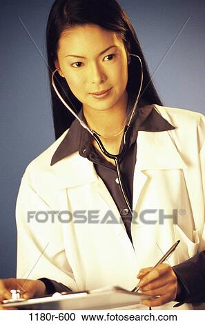 Stock Image - people, woman, Asian, doctor, stethoscope, chart, medicine. Fotosearch