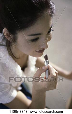 people, woman, Asian, makeup, lipstick, beauty View Large Photo Image Stock Photo - people, woman, Asian, makeup, lipstick, beauty. Fotosearch
