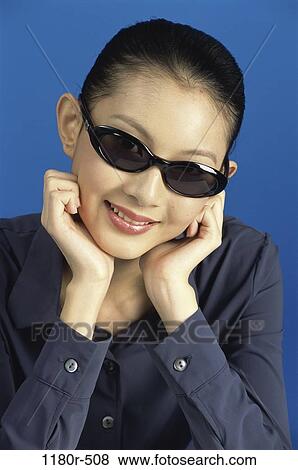 people, woman, Asian, sunglasses, brunette, indoors, young adult View Large Photo Image Stock Photo - people, woman, Asian, sunglasses, brunette, indoors, young adult. Fotosearch