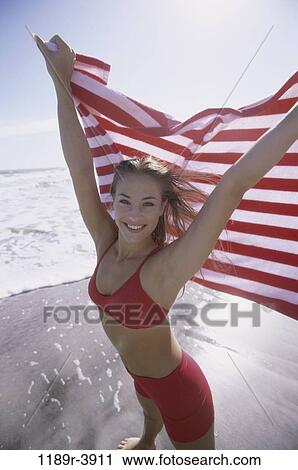 Stock Image - people, woman, beach, blond, Caucasian, beach towel. Fotosearch