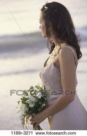 people, woman, beach, bouquet, romance, brunette, bride View Large Photo Image Stock Image - people, woman, beach, bouquet, romance, brunette, bride. Fotosearch