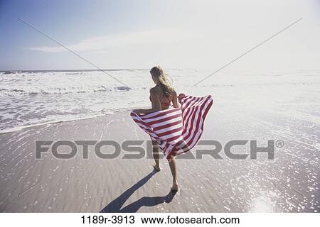 people, woman, beach, Caucasian, beach towel, swimwear View Large Photo Image Stock Image - people, woman, beach, Caucasian, beach towel, swimwear. Fotosearch