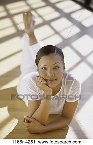 people, woman, brunette, indoors, African-American, young adult, Young women indoors View Large Photo Image Stock Image - people, woman, brunette, indoors, African-American, young adult, Young women indoors. Fotosearch