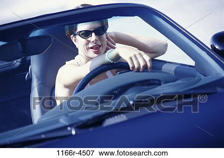 people, woman, car, convertible, sunglasses, outdoors, transportation View Large Photo Image Stock Photo - people, woman, car, convertible, sunglasses, outdoors, transportation. Fotosearch