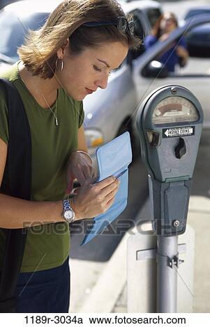 Stock Image - people, woman, car, outdoors, parking, brunette, expired. Fotosearch