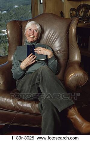 people, woman, chair, senior, reading, leather, book View Large Photo Image Stock Photography - people, woman, chair, senior, reading, leather, book. Fotosearch