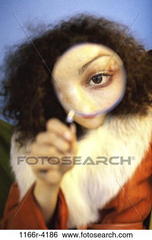 people, woman, coat, brunette, magnifying glass, indoors, African-American View Large Photo Image Stock Photograph - people, woman, coat, brunette, magnifying glass, indoors, African-American. Fotosearch
