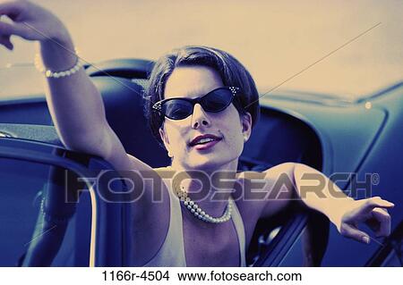 people, woman, convertible, sunglasses, pearls, outdoors, jewelry View Large Photo Image Picture - people, woman, convertible, sunglasses, pearls, outdoors, jewelry. Fotosearch