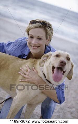 people, woman, dog, pet, beach, sunglasses, hugging View Large Photo Image Stock Image - people, woman, dog, pet, beach, sunglasses, hugging. Fotosearch