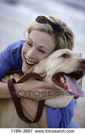 people, woman, dog, pet, sunglasses, outdoors, hugging View Large Photo Image Stock Photo - people, woman, dog, pet, sunglasses, outdoors, hugging. Fotosearch