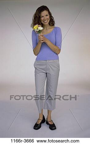 people, woman, flowers, brunette, indoors, Caucasian, young adult View Large Photo Image Stock Photograph - people, woman, flowers, brunette, indoors, Caucasian, young adult. Fotosearch